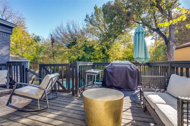 a view of a patio with a table chairs and a potted plant