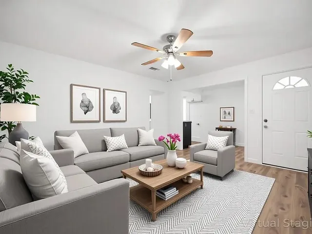 a living room with furniture and a large window