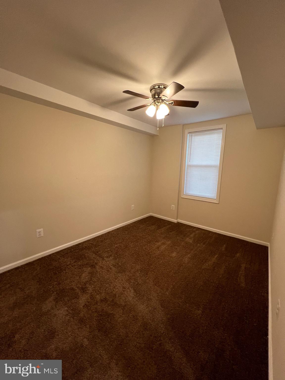 834 19th Street Northeast Washington, DC 20002 - Photo 4 of 19 an empty room with windows and fan