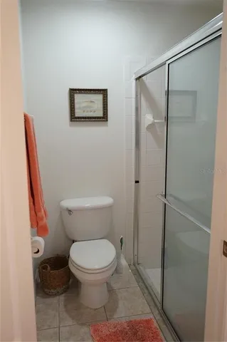 a white toilet sitting next to a bathroom sink