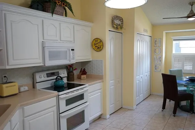 a kitchen with stainless steel appliances granite countertop a sink and a cabinets