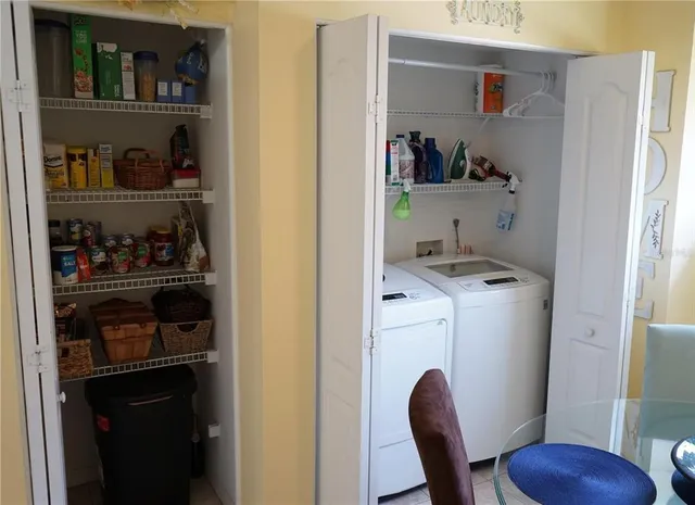 a kitchen with a refrigerator and cabinets