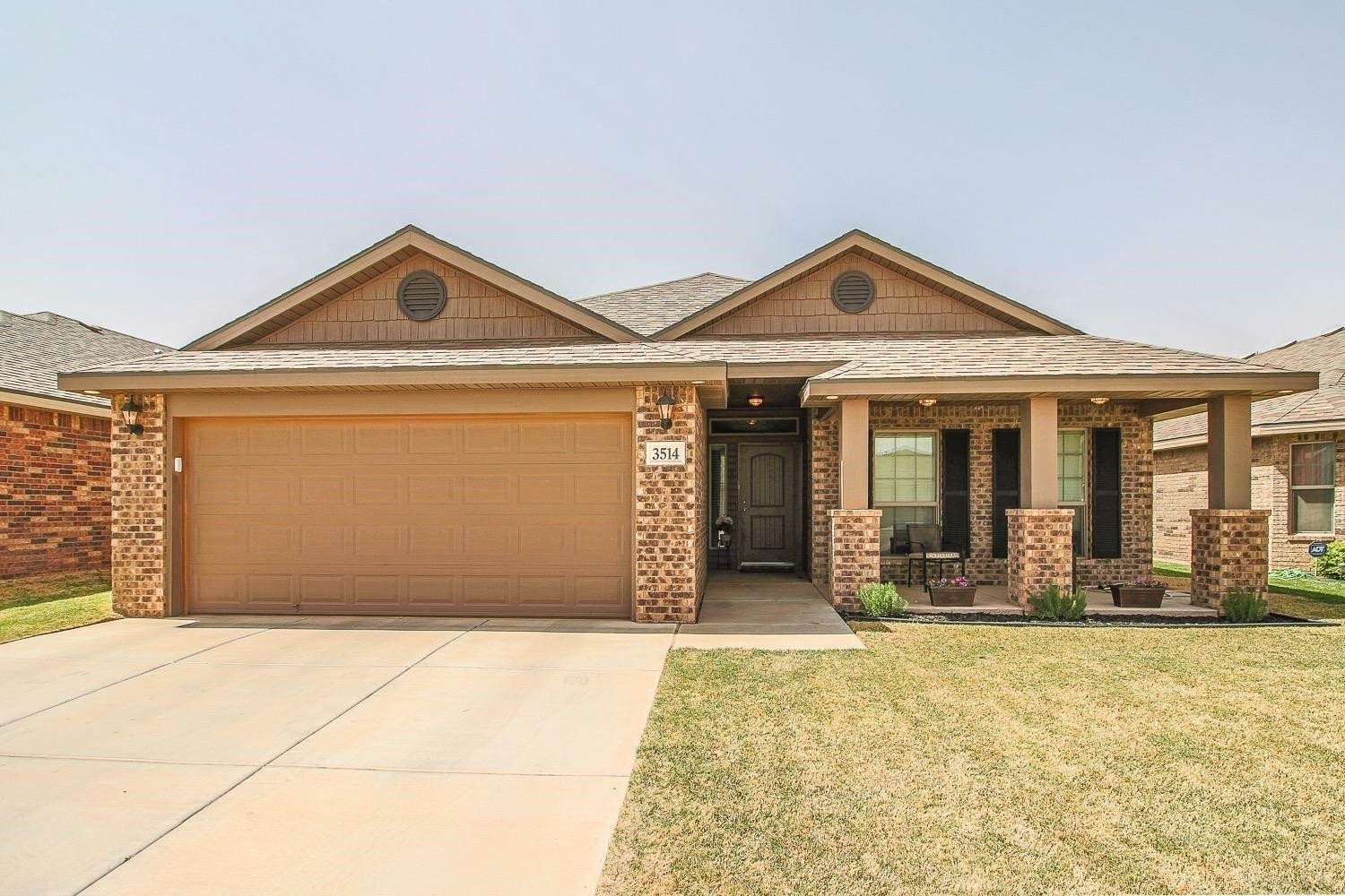 a front view of a house with yard