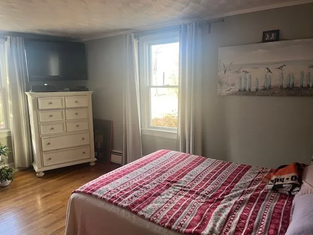 a bedroom with a bed and chair