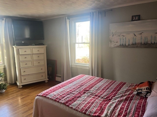 23 Lakewood Road Yarmouth, MA 02664 - Photo 9 of 15 a bedroom with a bed and chair