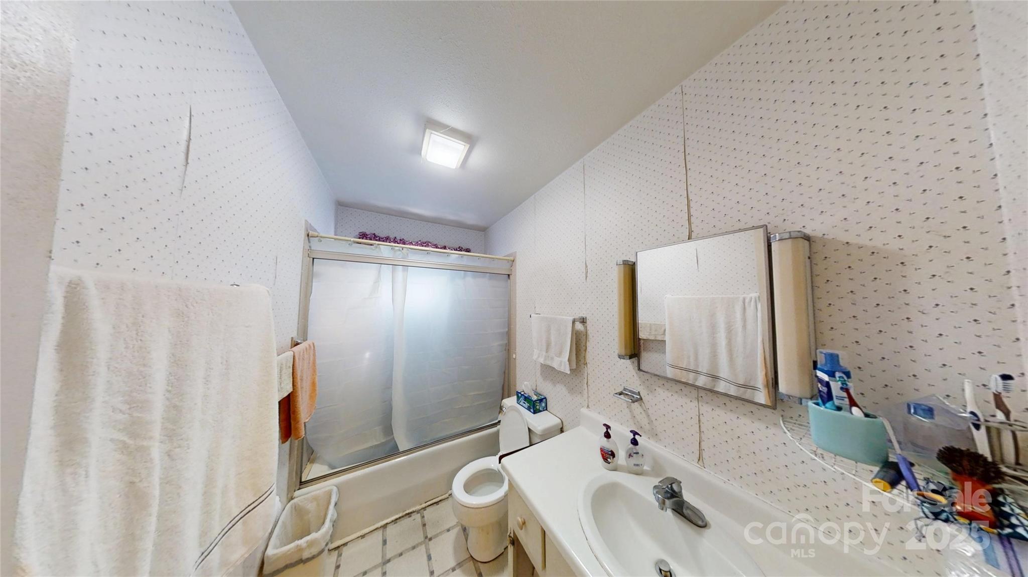 111 Cisco Road Asheville, NC 28805 - Photo 14 of 30 a bathroom with a sink and a mirror