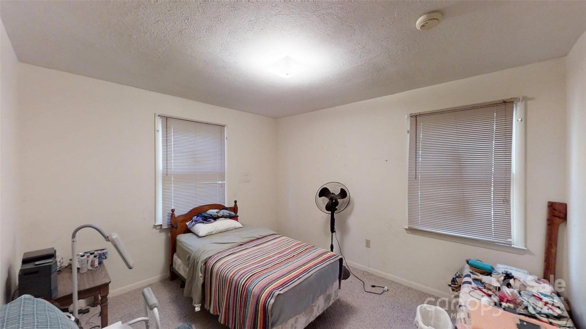 111 Cisco Road Asheville, NC 28805 - Photo 17 of 30 a bedroom with a bed and a window