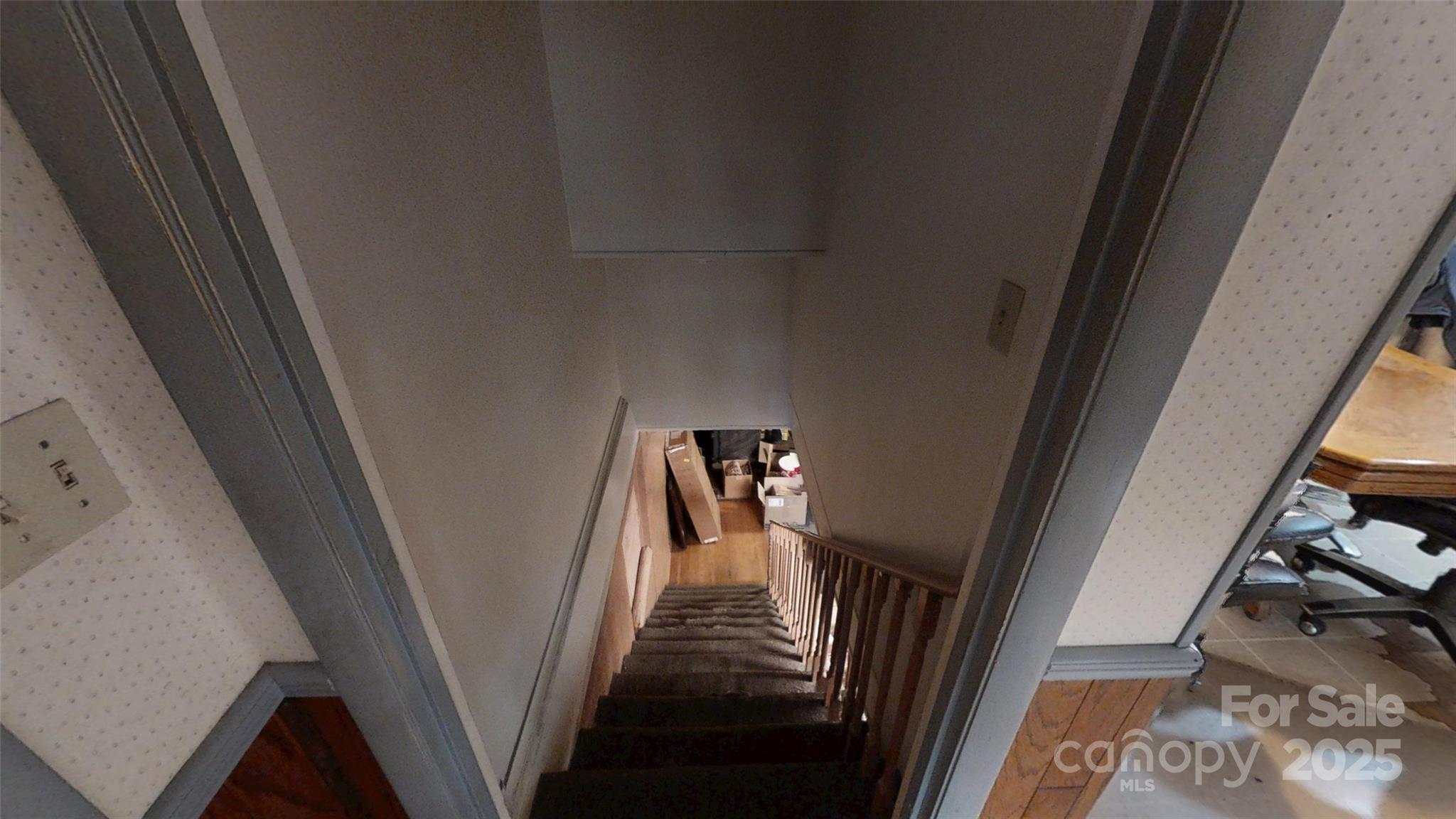 111 Cisco Road Asheville, NC 28805 - Photo 18 of 30 a view of a hallway with wooden floor and stairs