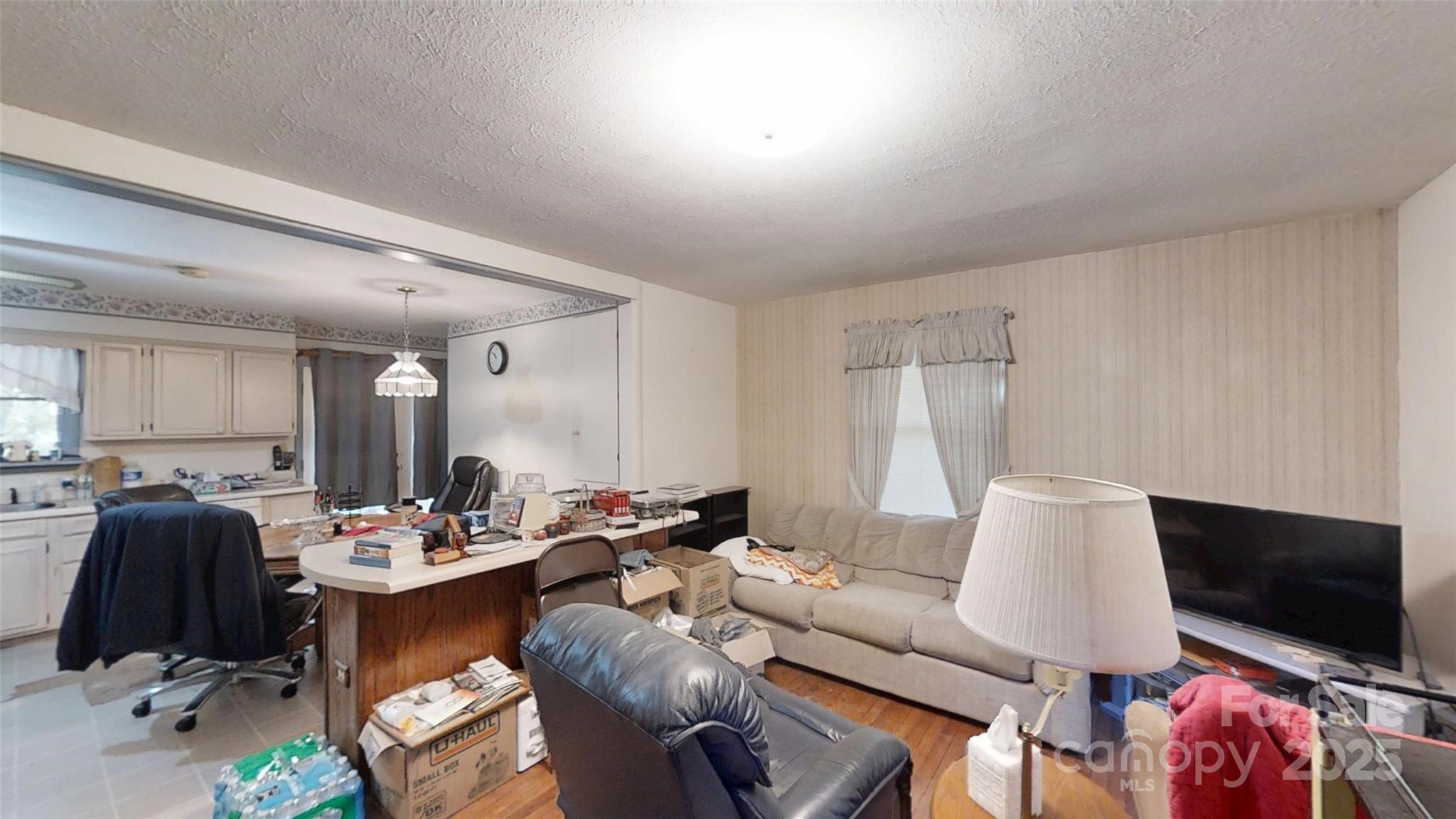 111 Cisco Road Asheville, NC 28805 - Photo 4 of 30 a living room with furniture and a flat screen tv