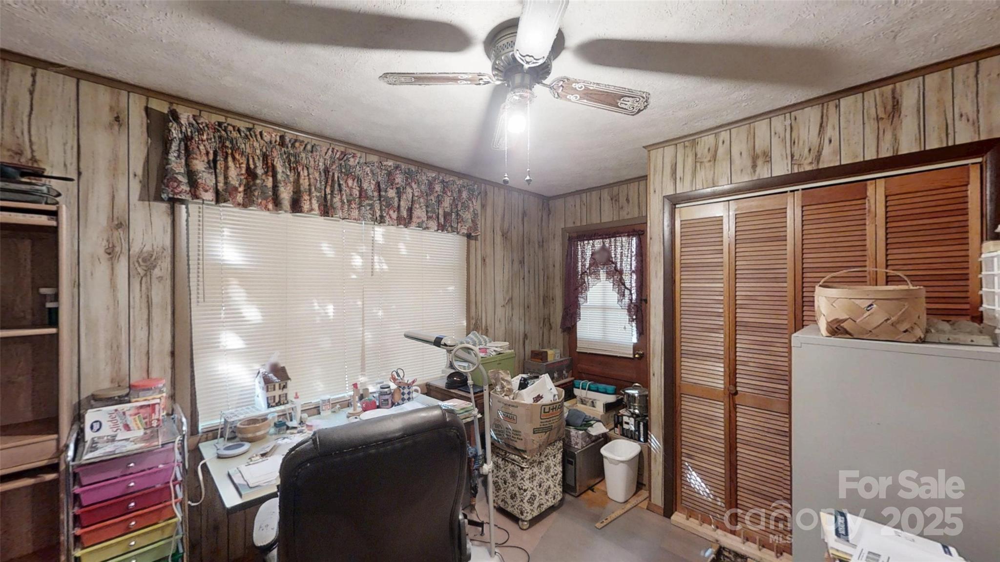 111 Cisco Road Asheville, NC 28805 - Photo 9 of 30 a view of a livingroom with furniture and a ceiling fan