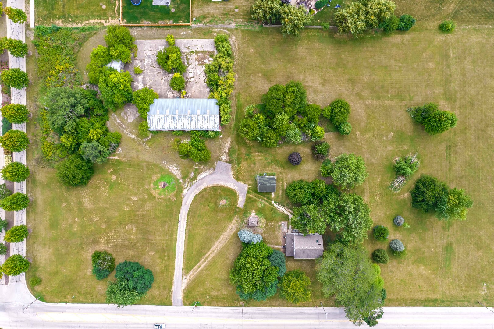 870 Simons Road Plainfield, IL 60585 - Photo 10 of 14 an aerial view of a house with a garden and lake view