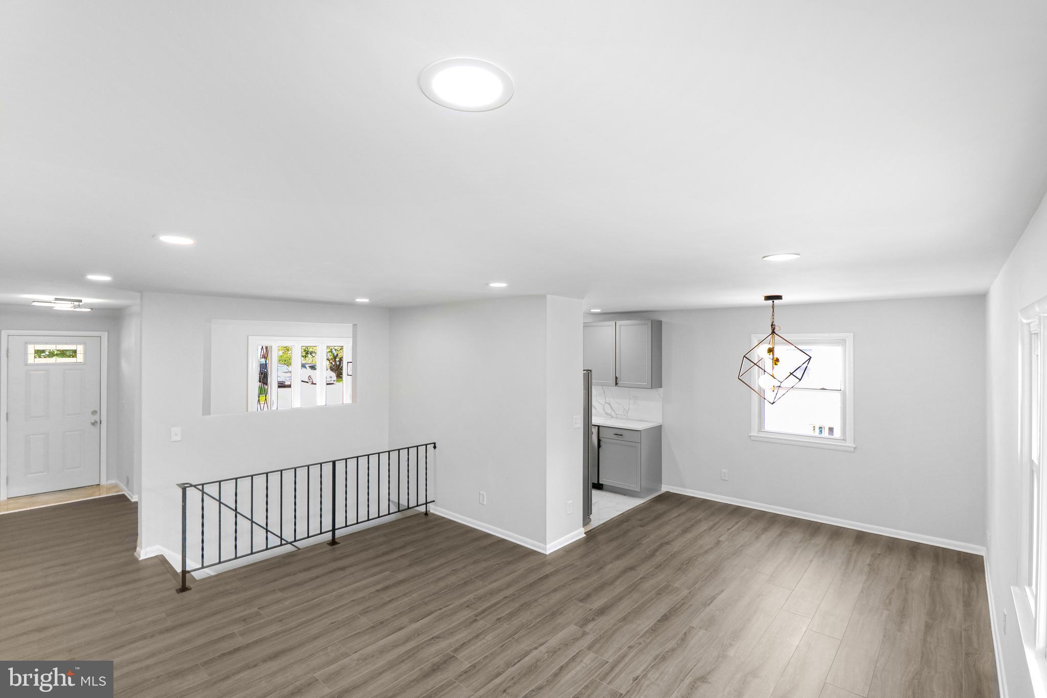 3311 Michele Lane Mitchellville, MD 20721 - Photo 12 of 44 an empty room with wooden floor and windows