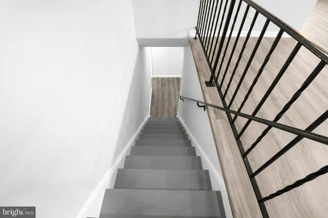 a view of staircase with rug