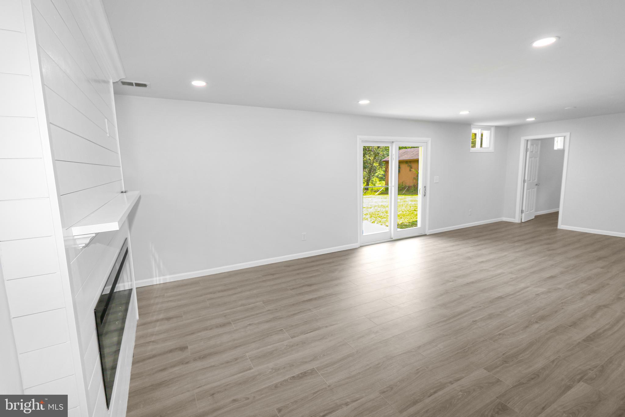 3311 Michele Lane Mitchellville, MD 20721 - Photo 26 of 44 an empty room with wooden floor and a window