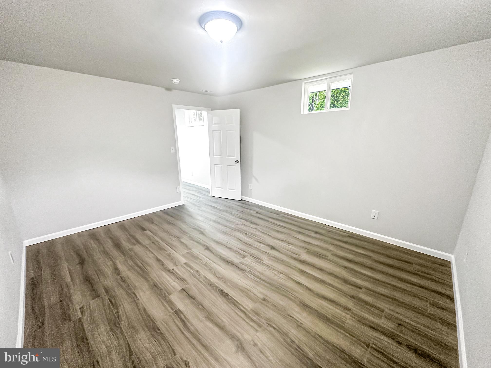 3311 Michele Lane Mitchellville, MD 20721 - Photo 31 of 44 a view of an empty room with wooden floor