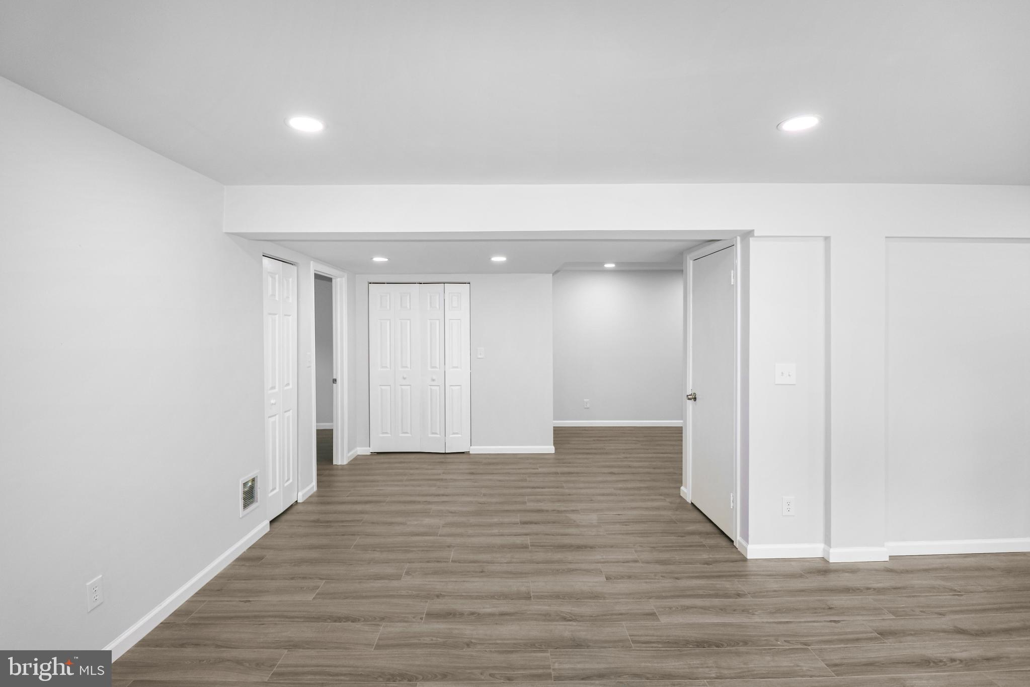 3311 Michele Lane Mitchellville, MD 20721 - Photo 32 of 44 a view of an empty room with wooden floor