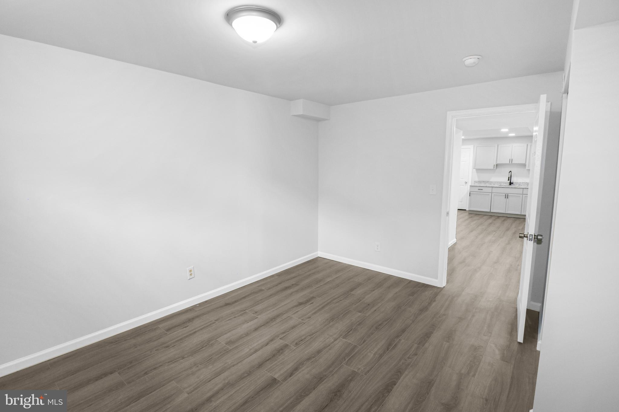 3311 Michele Lane Mitchellville, MD 20721 - Photo 34 of 44 a view of a room with wooden floor