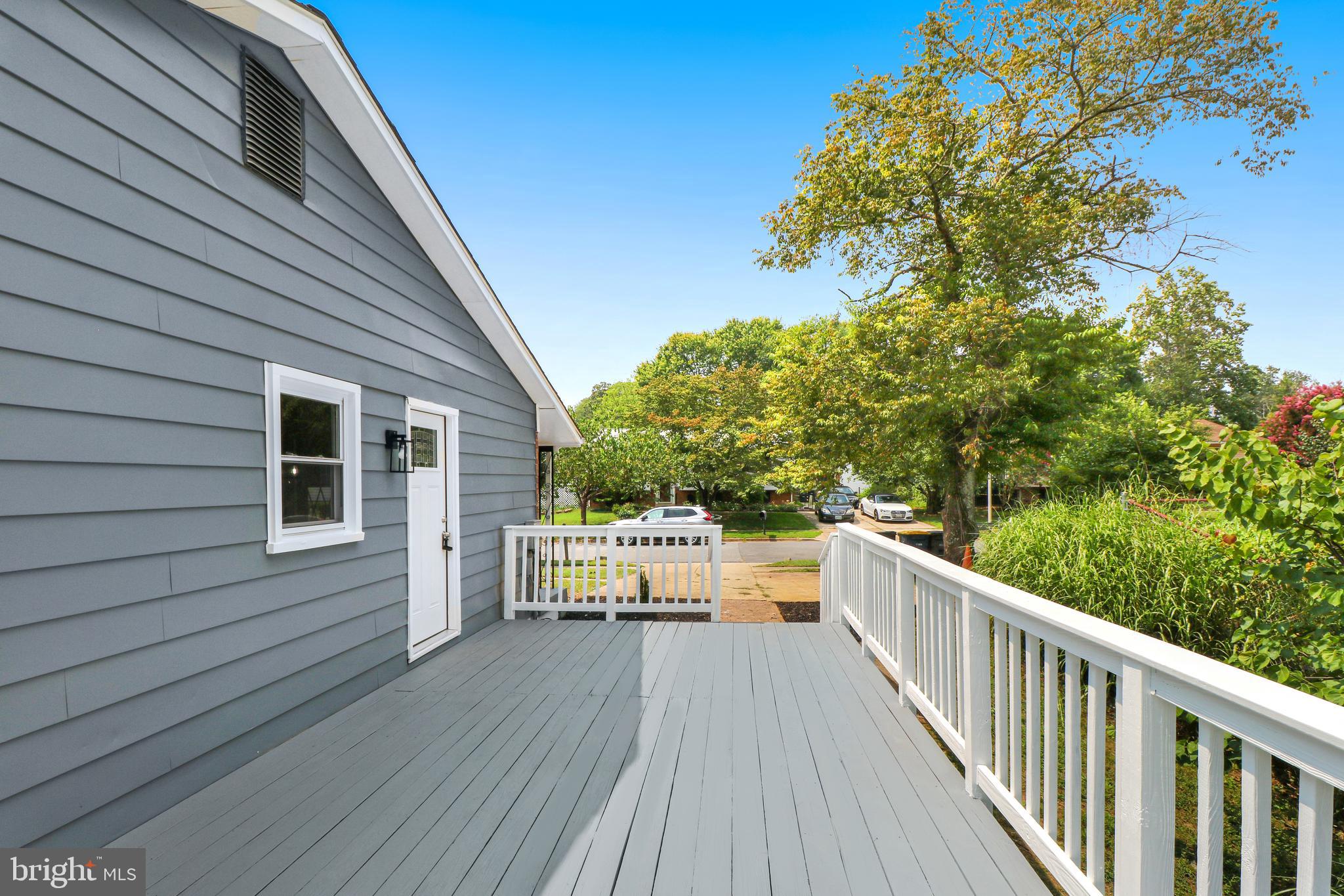 3311 Michele Lane Mitchellville, MD 20721 - Photo 37 of 44 a view of a wooden deck and a yard