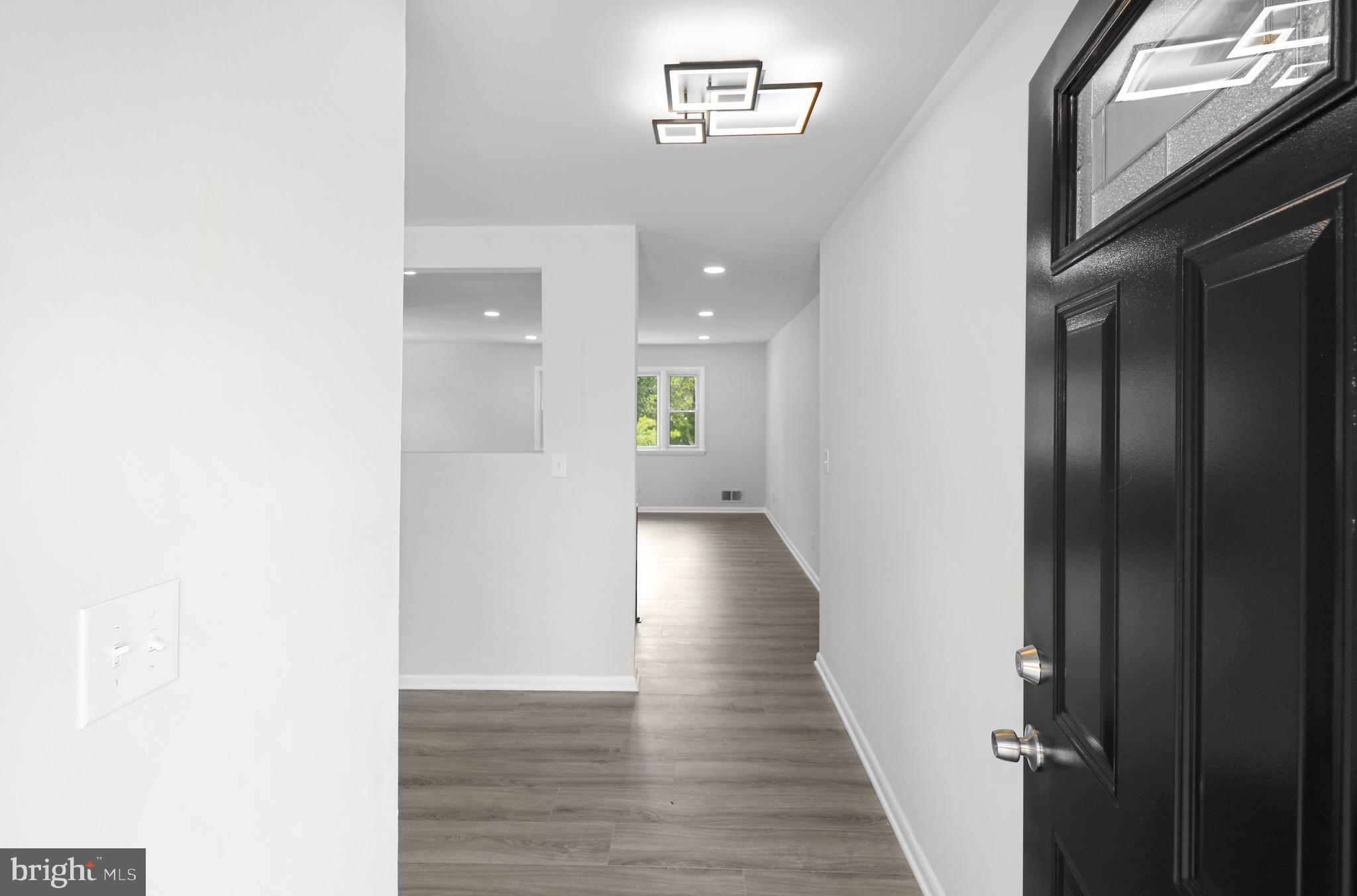 3311 Michele Lane Mitchellville, MD 20721 - Photo 4 of 44 a view of a hallway with wooden floor