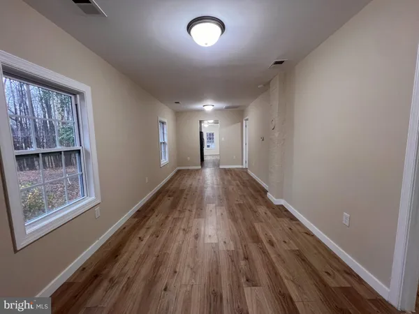 a view of entryway with wooden floor