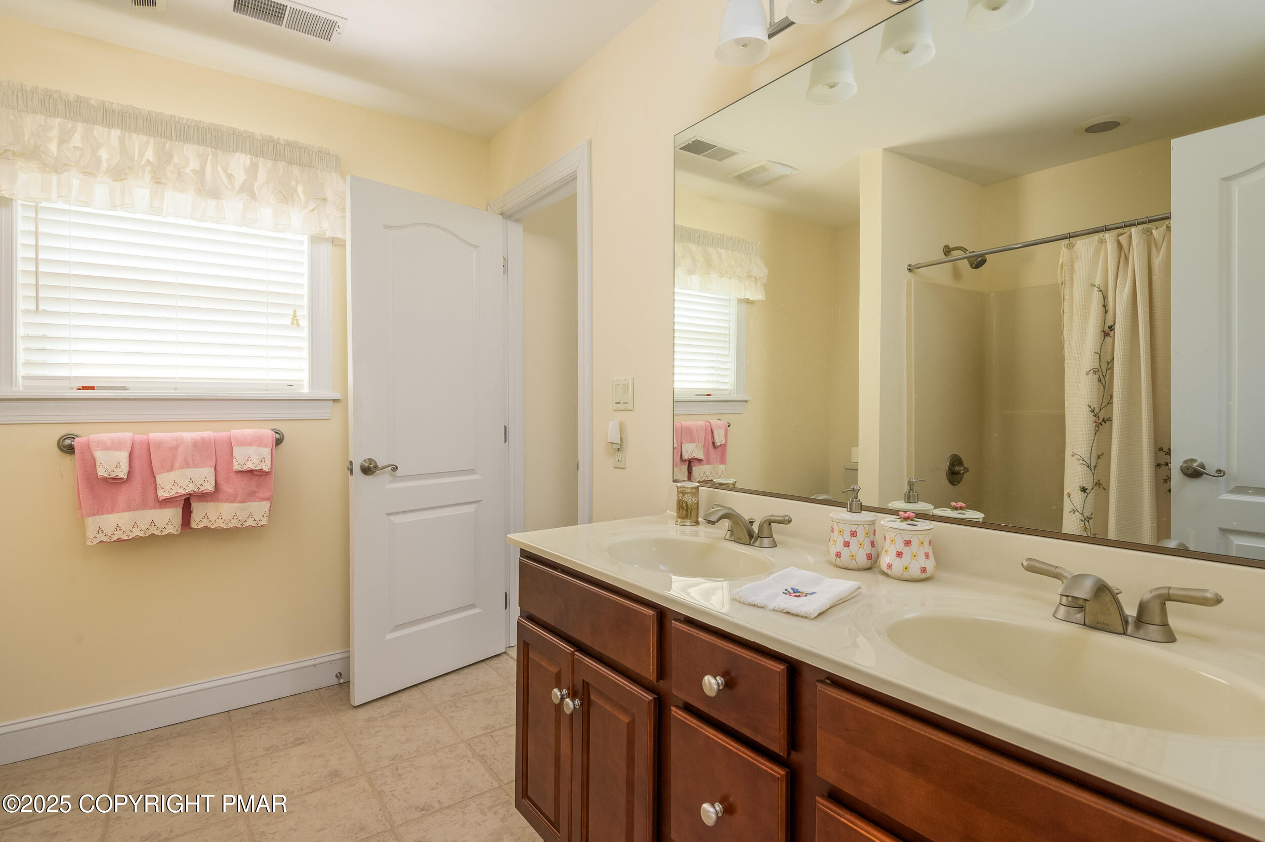 969 Hideaway Hill Road Kunkletown, PA 18058 - Photo 14 of 56 a bathroom with a double vanity sink and a mirror