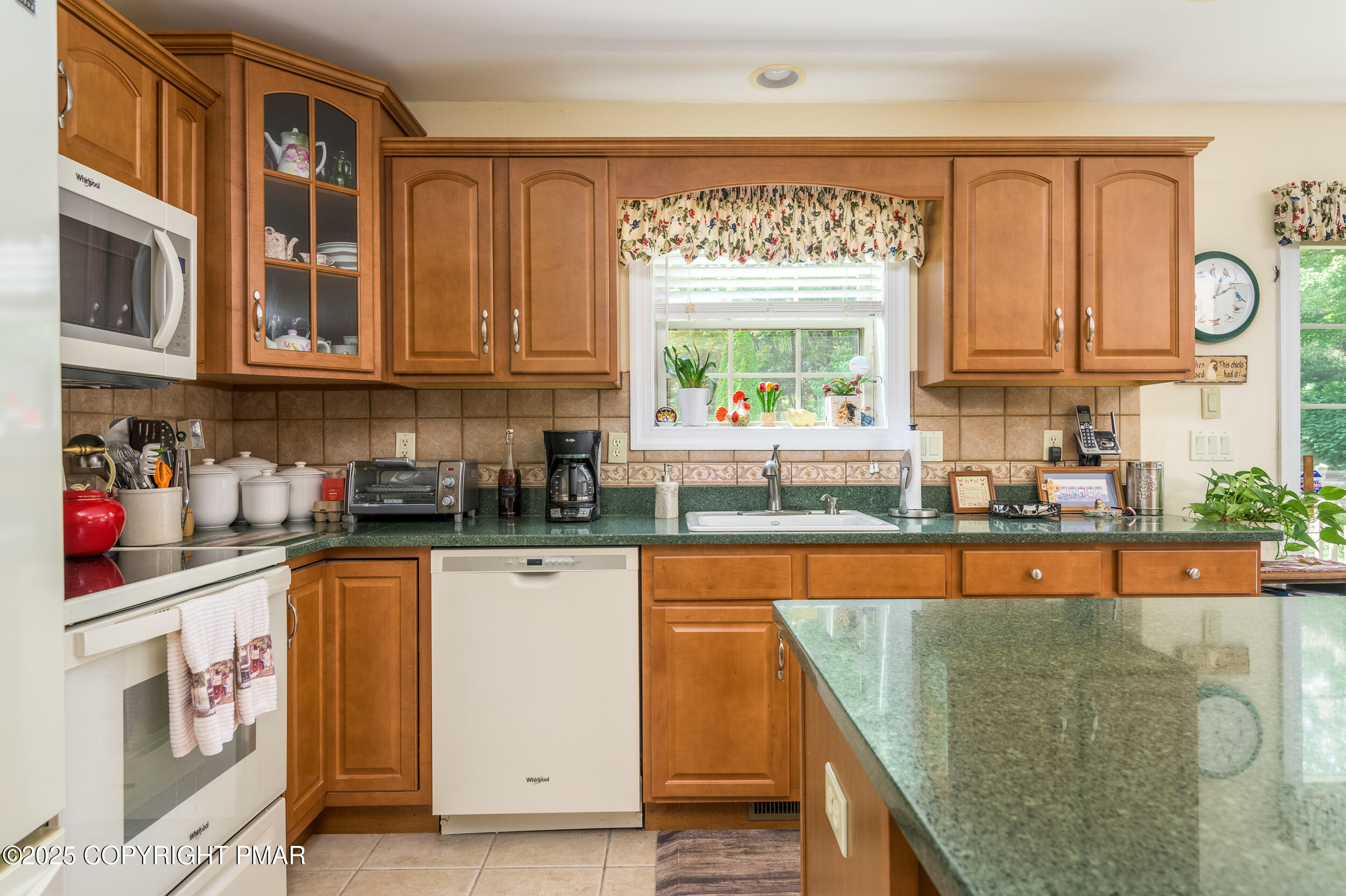 969 Hideaway Hill Road Kunkletown, PA 18058 - Photo 41 of 56 a kitchen with stainless steel appliances granite countertop a stove a sink and a microwave