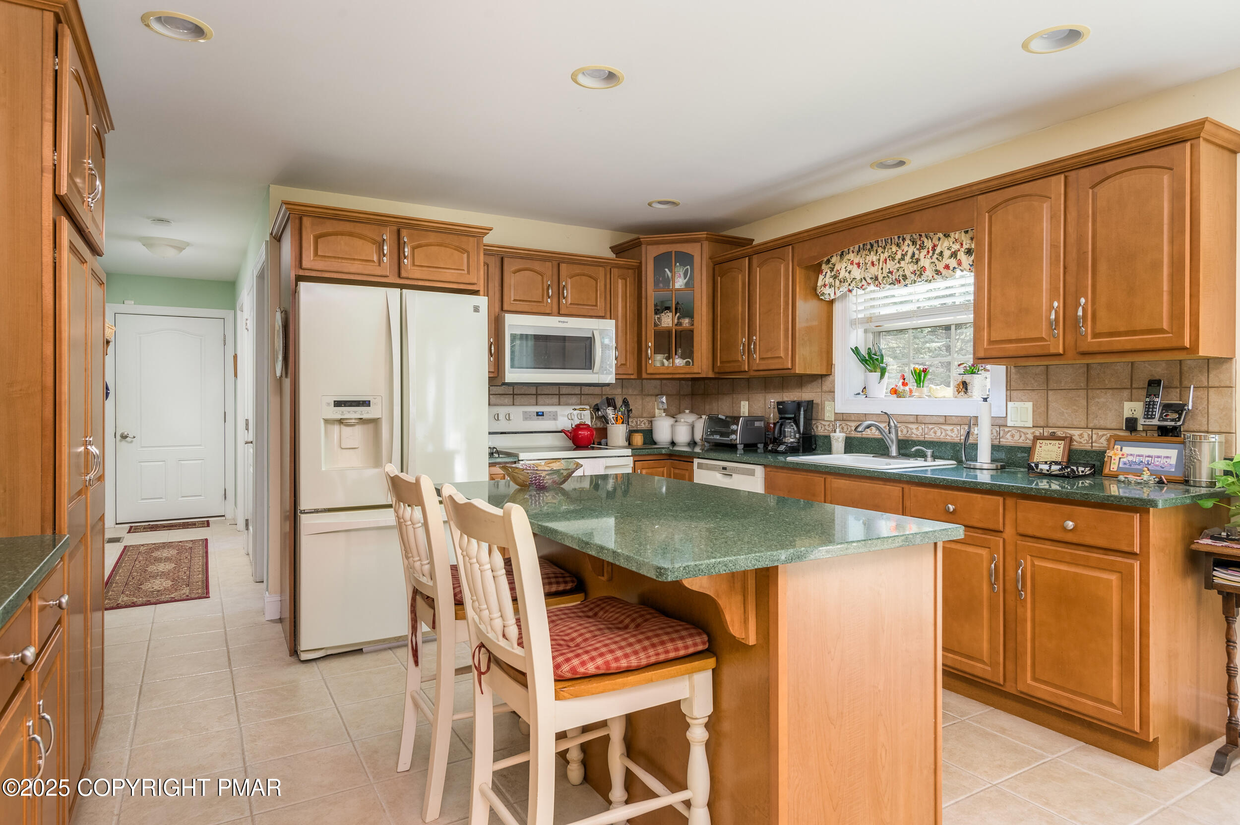 969 Hideaway Hill Road Kunkletown, PA 18058 - Photo 44 of 56 a kitchen with stainless steel appliances granite countertop a stove top oven a sink refrigerator and cabinets