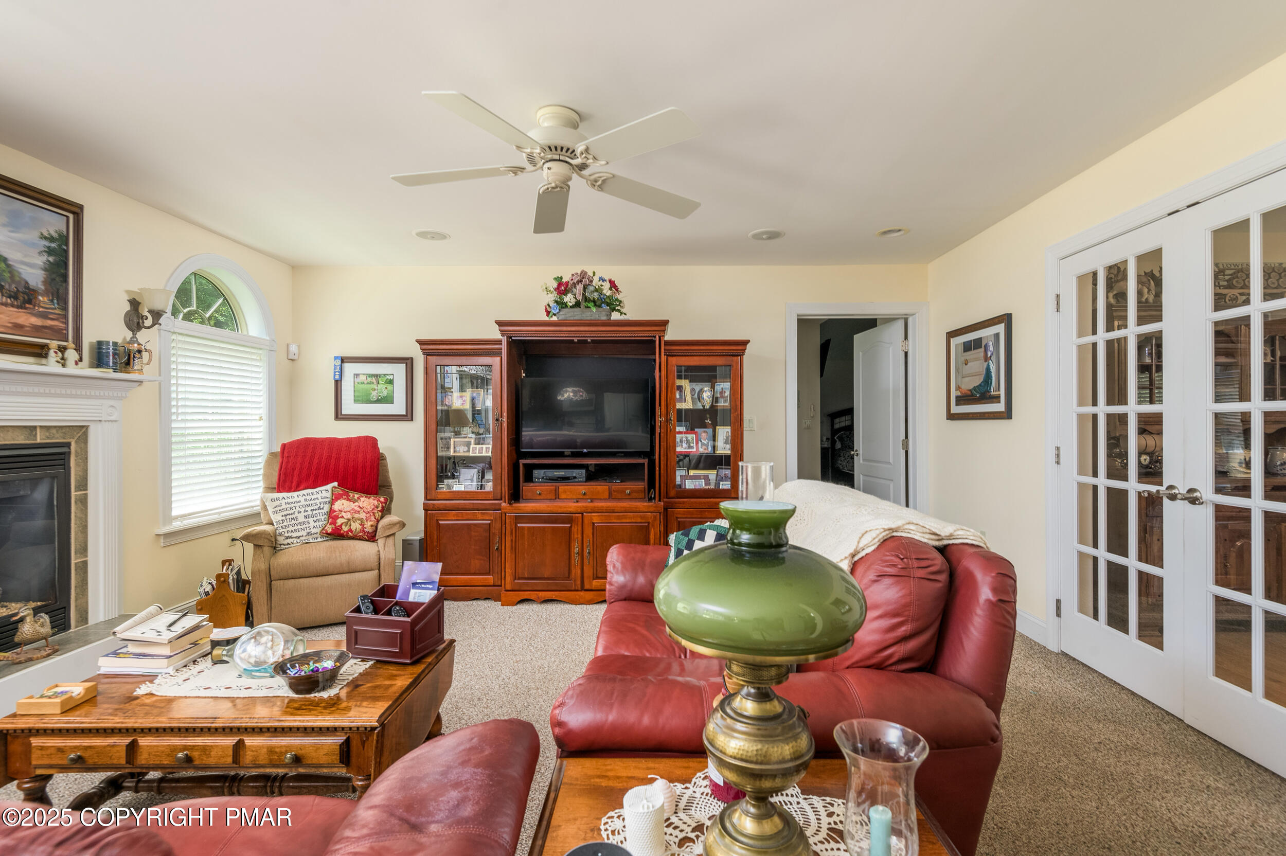 969 Hideaway Hill Road Kunkletown, PA 18058 - Photo 45 of 56 a living room with furniture a flat screen tv and a fireplace
