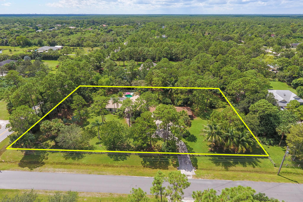 15429 Jupiter Farms Road Jupiter, FL 33478 - Photo 3 of 59 a view of a yard with a lake