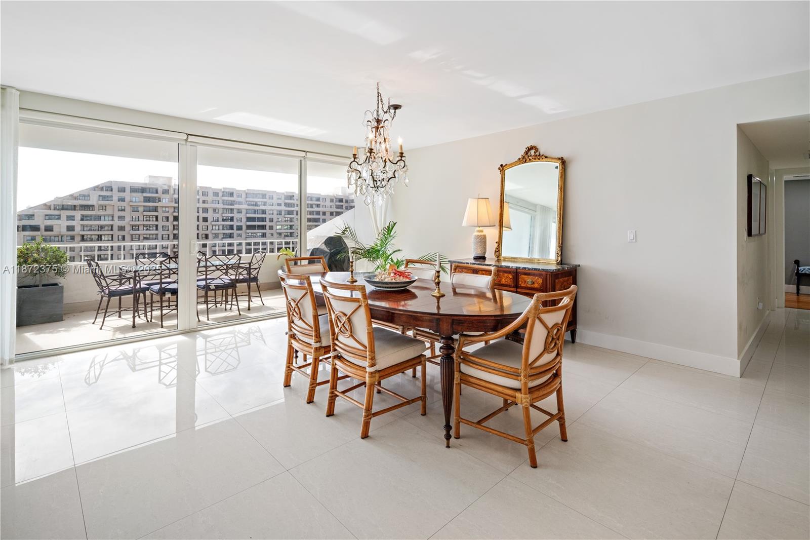 199 Ocean Ln Drive, Unit 1005 Key Biscayne, FL 33149 - Photo 11 of 35 a dining room with furniture and window