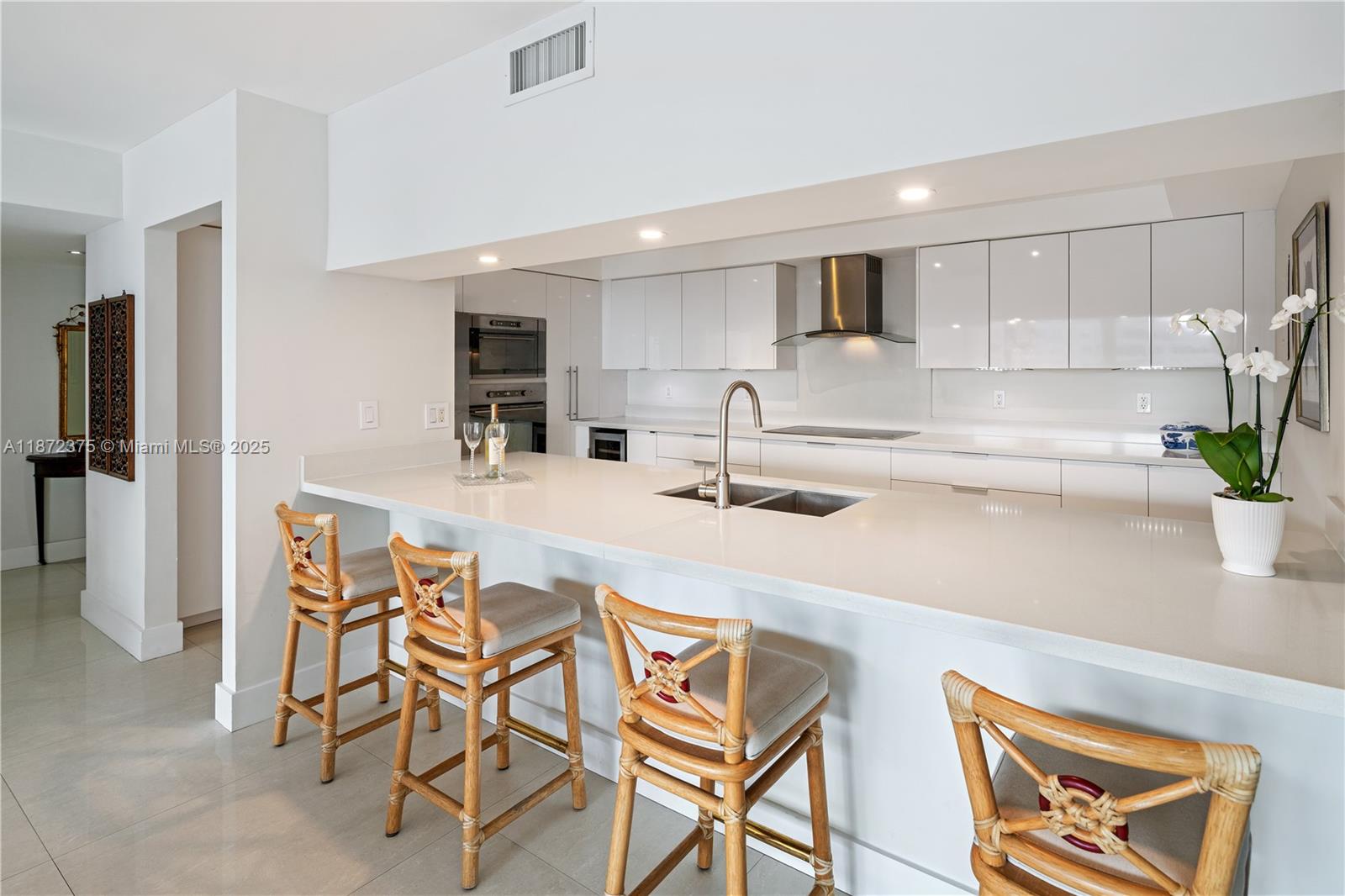 199 Ocean Ln Drive, Unit 1005 Key Biscayne, FL 33149 - Photo 12 of 35 a kitchen with stainless steel appliances a sink a refrigerator and cabinets