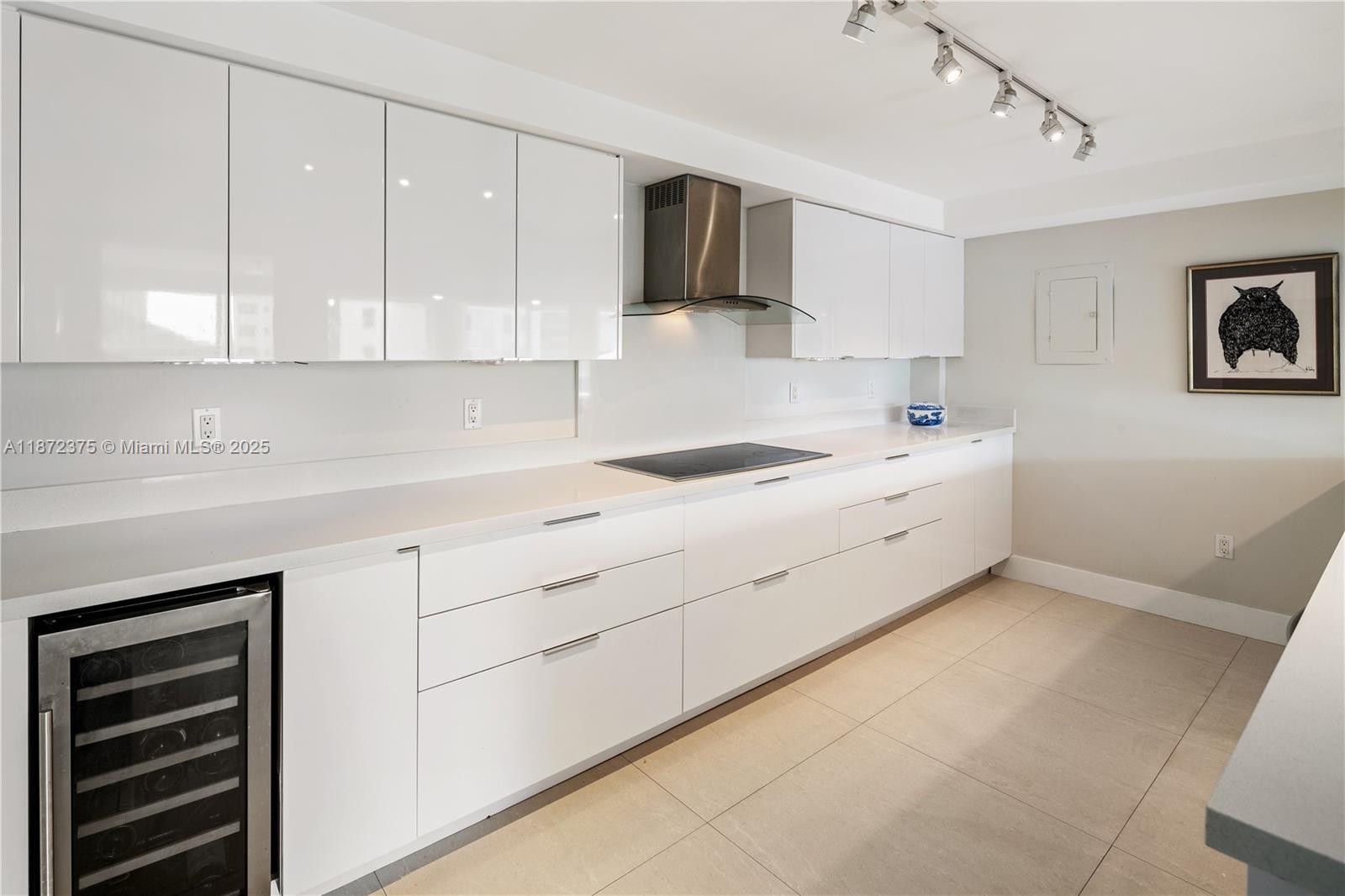 199 Ocean Ln Drive, Unit 1005 Key Biscayne, FL 33149 - Photo 13 of 35 a kitchen with a cabinets and white appliances