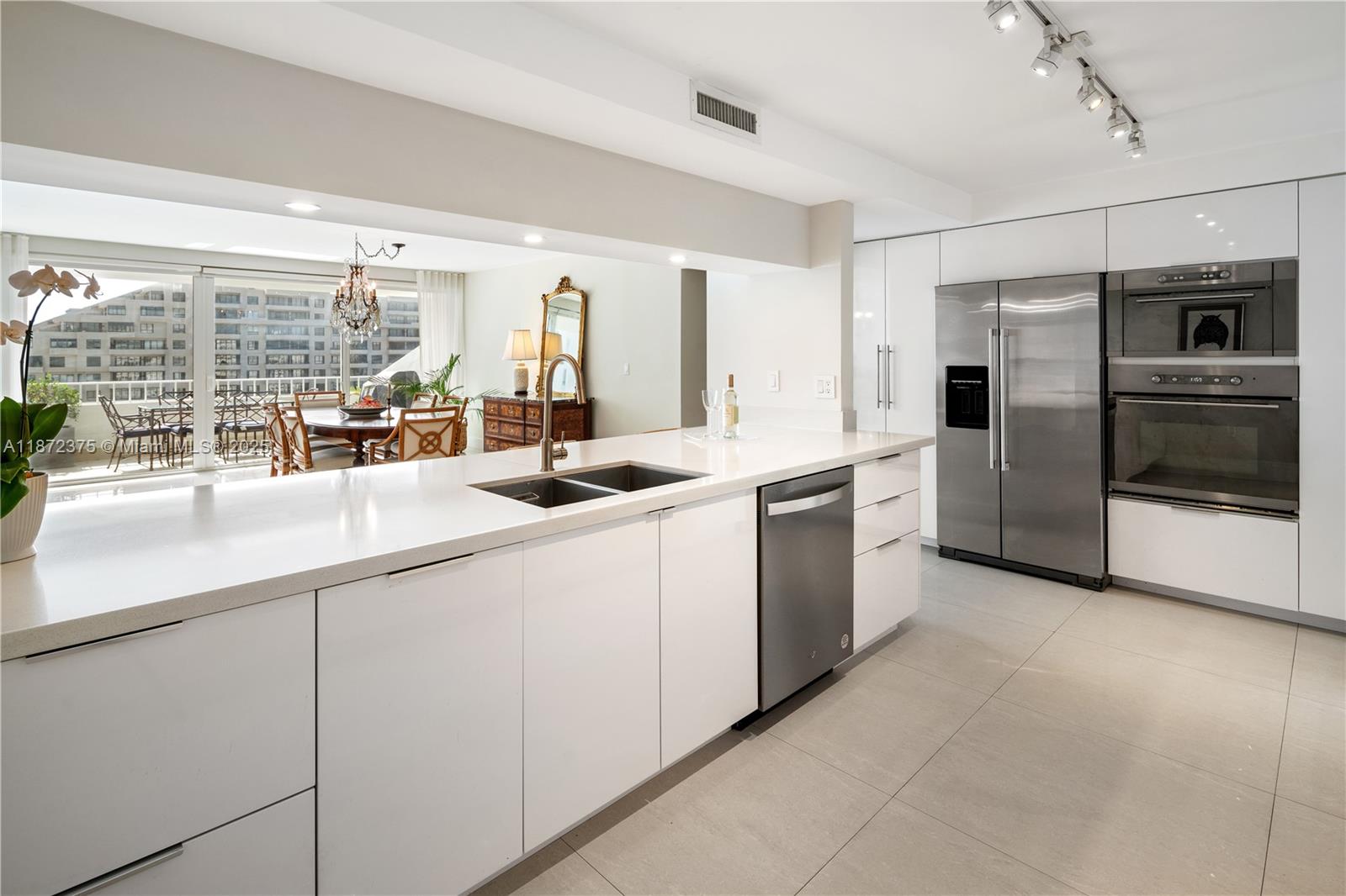 199 Ocean Ln Drive, Unit 1005 Key Biscayne, FL 33149 - Photo 15 of 35 a kitchen with stainless steel appliances a sink a stove and a refrigerator