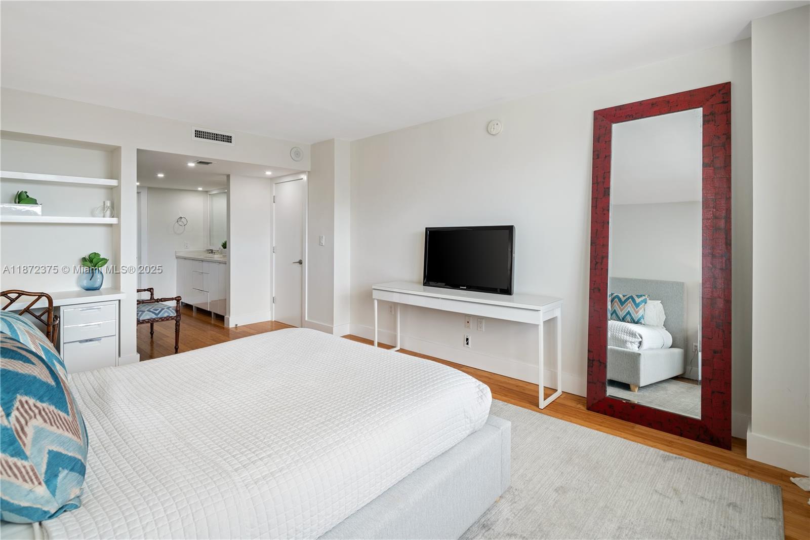 199 Ocean Ln Drive, Unit 1005 Key Biscayne, FL 33149 - Photo 17 of 35 a bedroom with a bed and a flat screen tv