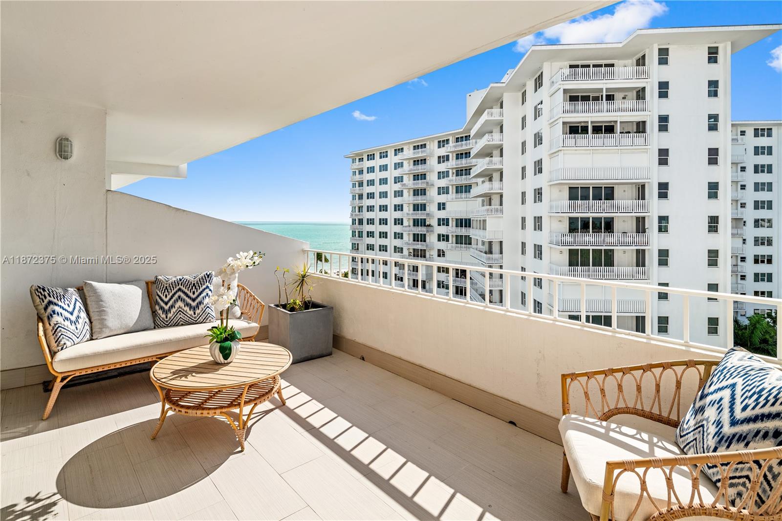 199 Ocean Ln Drive, Unit 1005 Key Biscayne, FL 33149 - Photo 2 of 35 a living room with furniture and a white wall