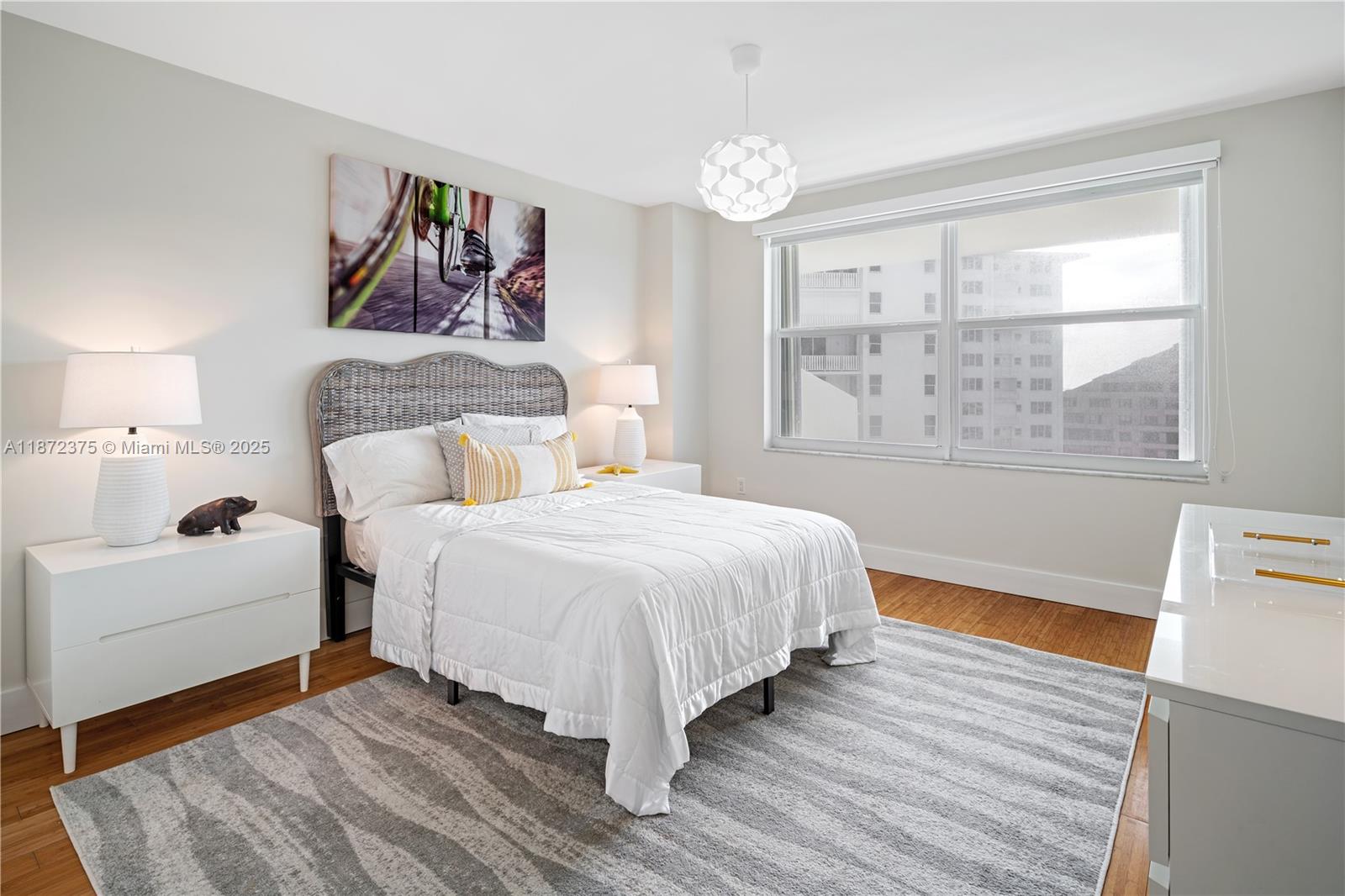 199 Ocean Ln Drive, Unit 1005 Key Biscayne, FL 33149 - Photo 24 of 35 a bedroom with a large bed and a window