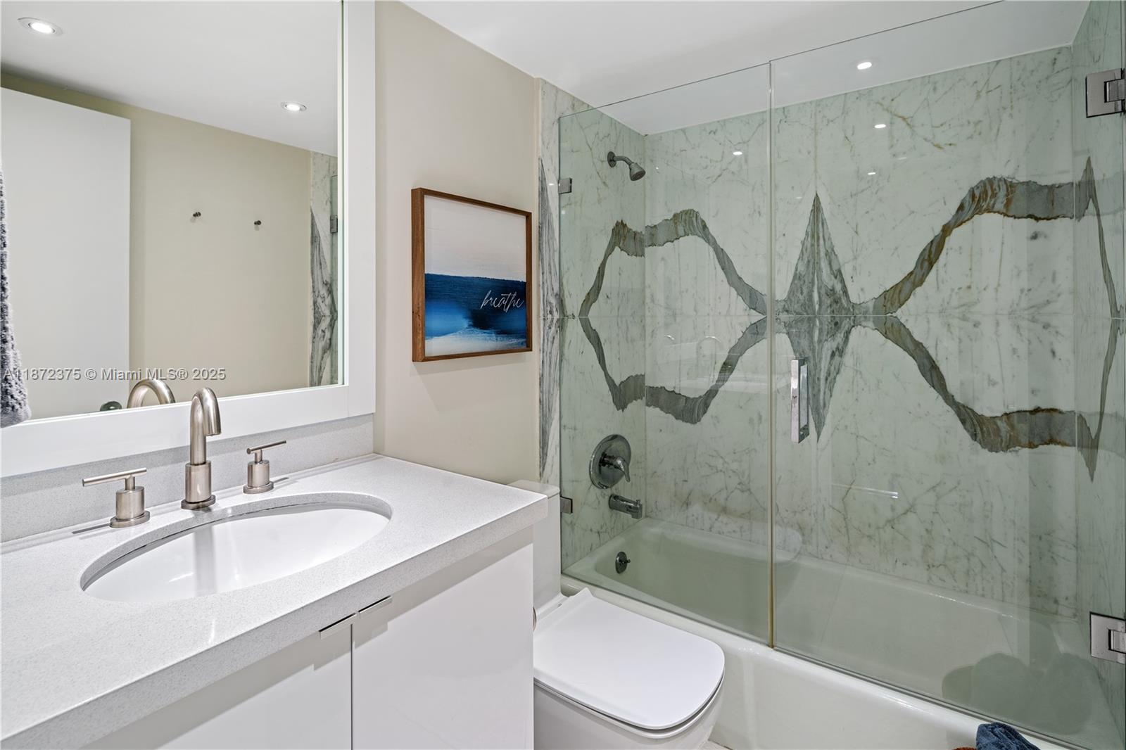 199 Ocean Ln Drive, Unit 1005 Key Biscayne, FL 33149 - Photo 26 of 35 a bathroom with a sink toilet and shower