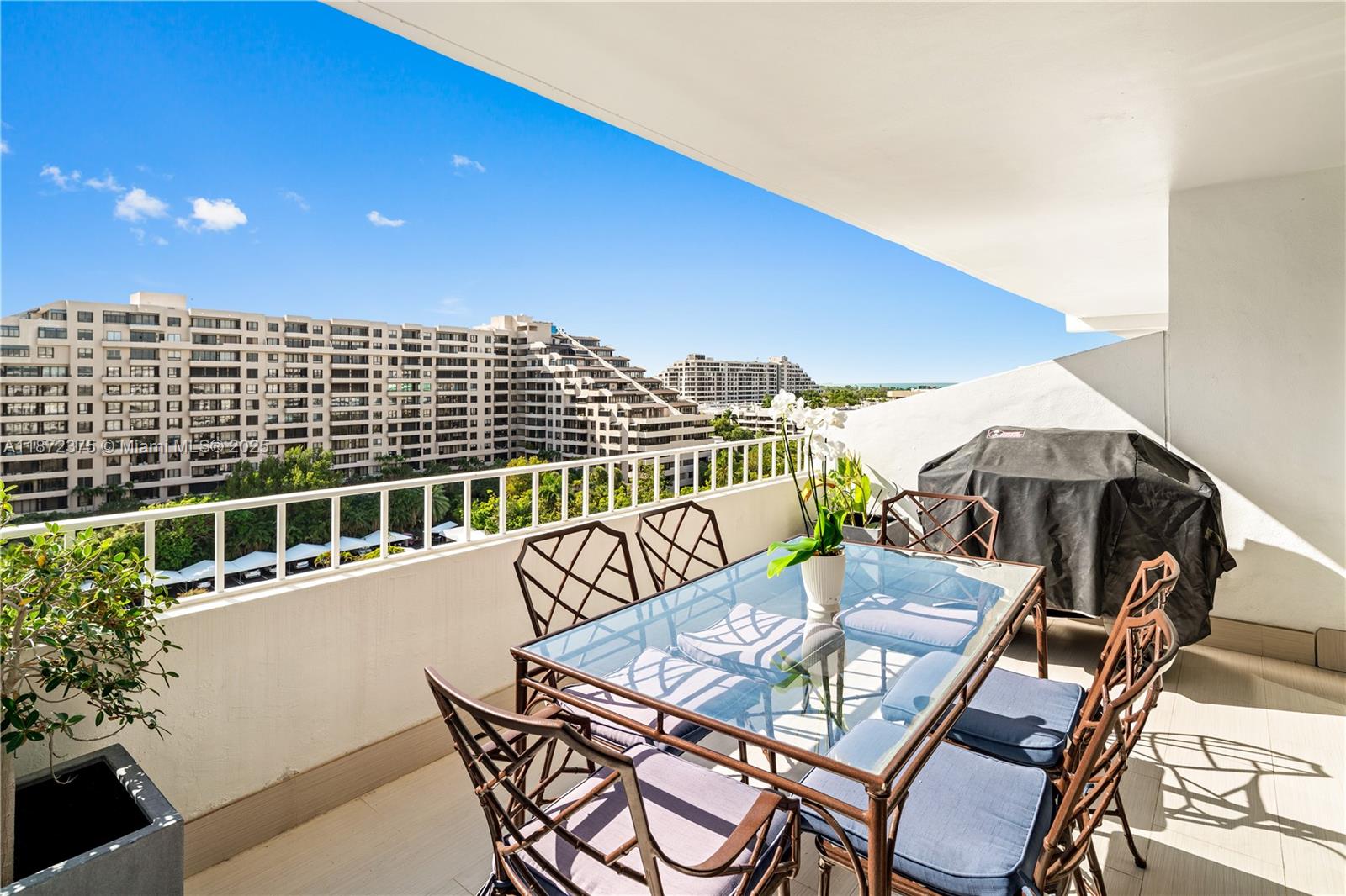199 Ocean Ln Drive, Unit 1005 Key Biscayne, FL 33149 - Photo 3 of 35 a view of a balcony with furniture and stove