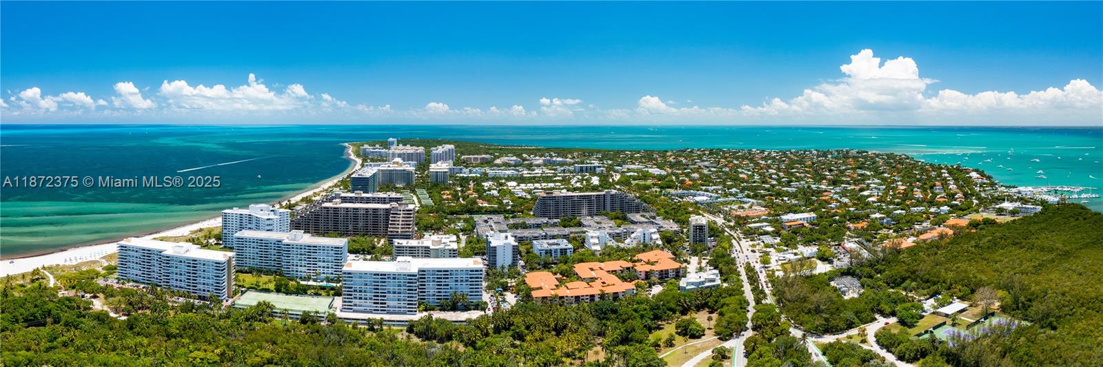 199 Ocean Ln Drive, Unit 1005 Key Biscayne, FL 33149 - Photo 35 of 35 a view of a fountain in middle of a lake and a yard