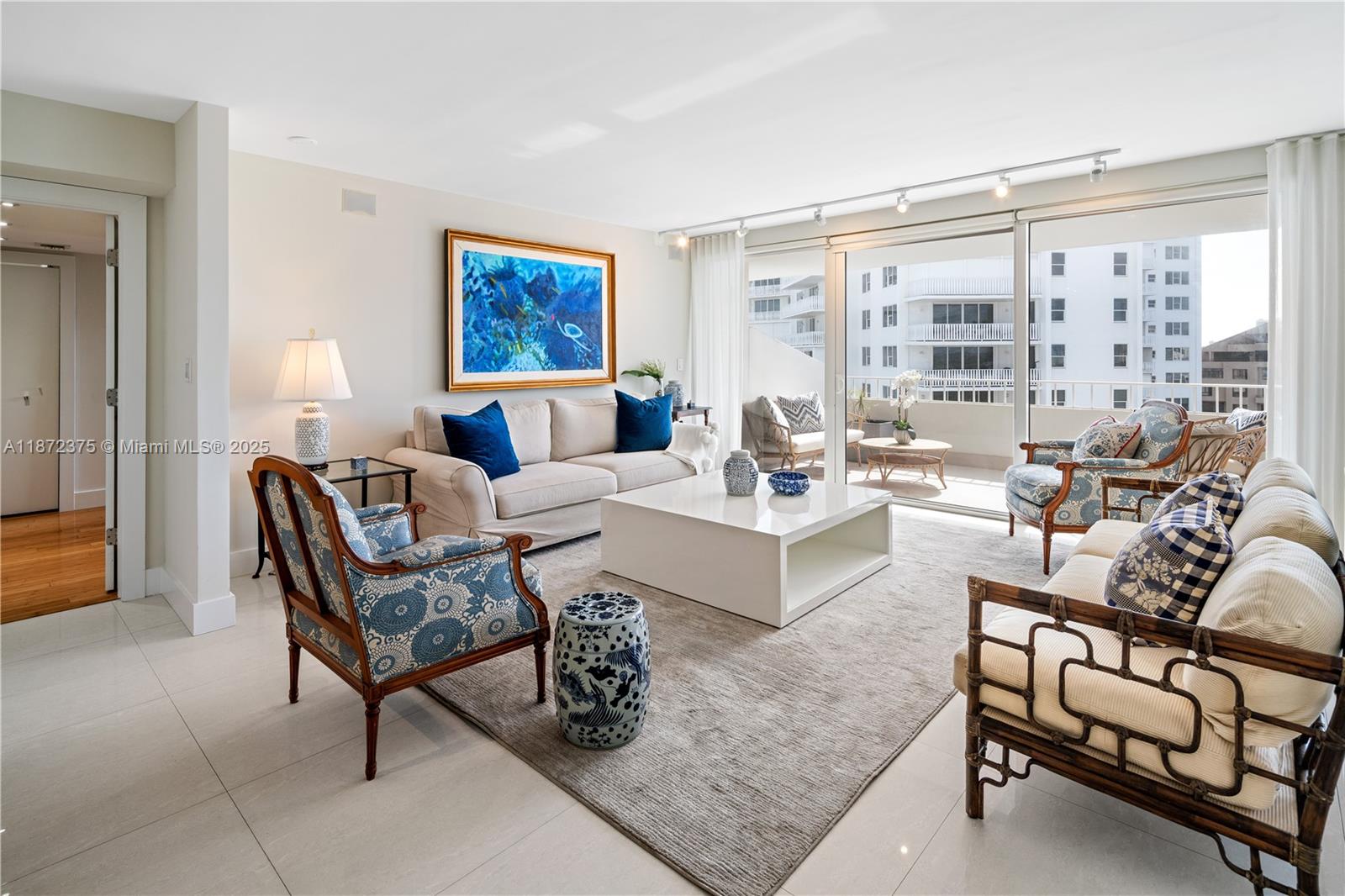 199 Ocean Ln Drive, Unit 1005 Key Biscayne, FL 33149 - Photo 4 of 35 a living room with furniture a rug and a large window