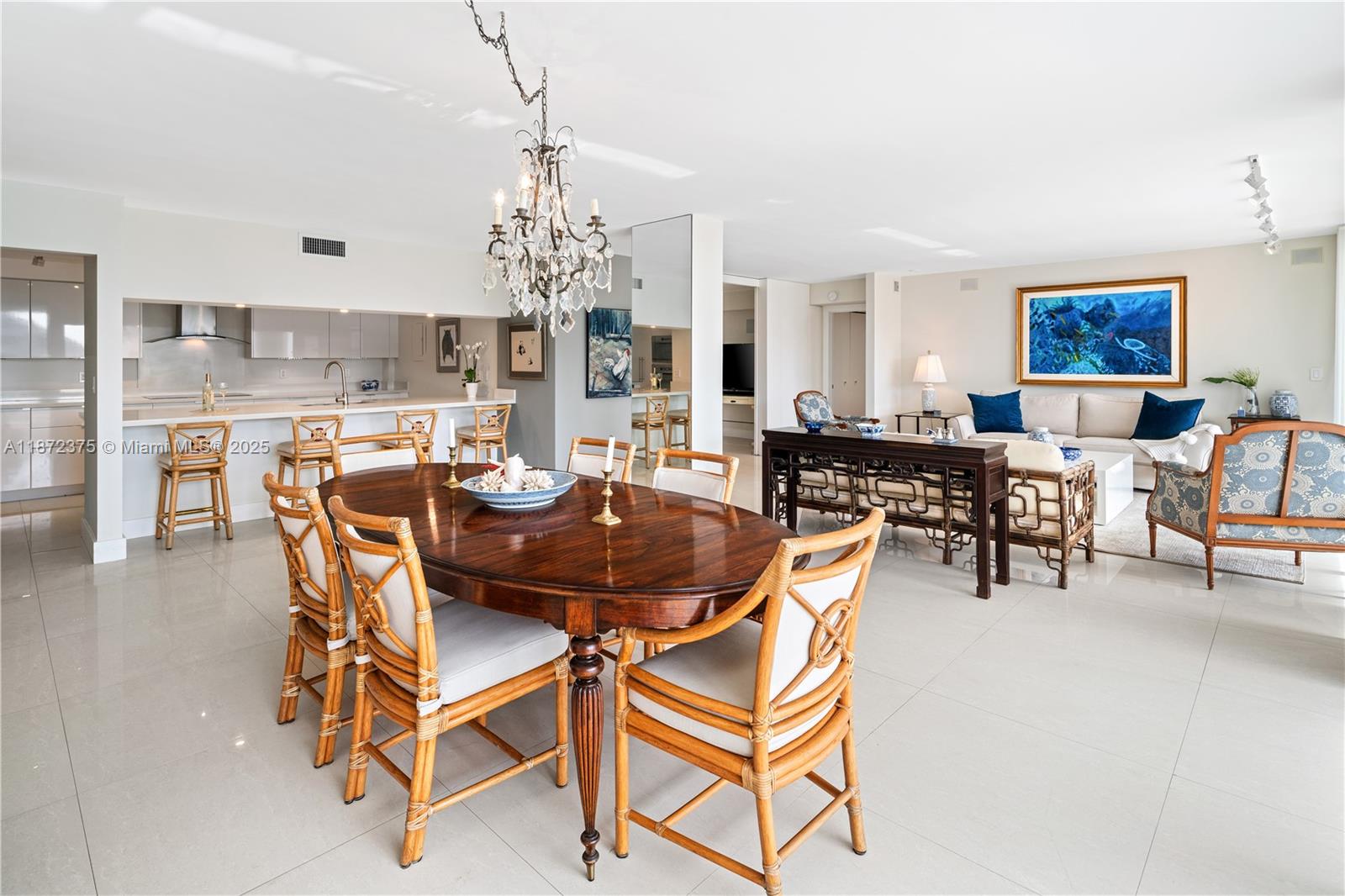 199 Ocean Ln Drive, Unit 1005 Key Biscayne, FL 33149 - Photo 9 of 35 a view of a dining room with furniture and chandelier