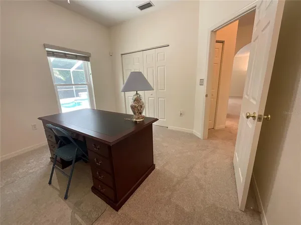 a room that has a table and a chair in it