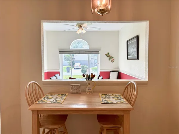 a view of a dining room with furniture window and outside view