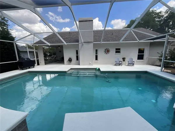 a view of a backyard with a lake view