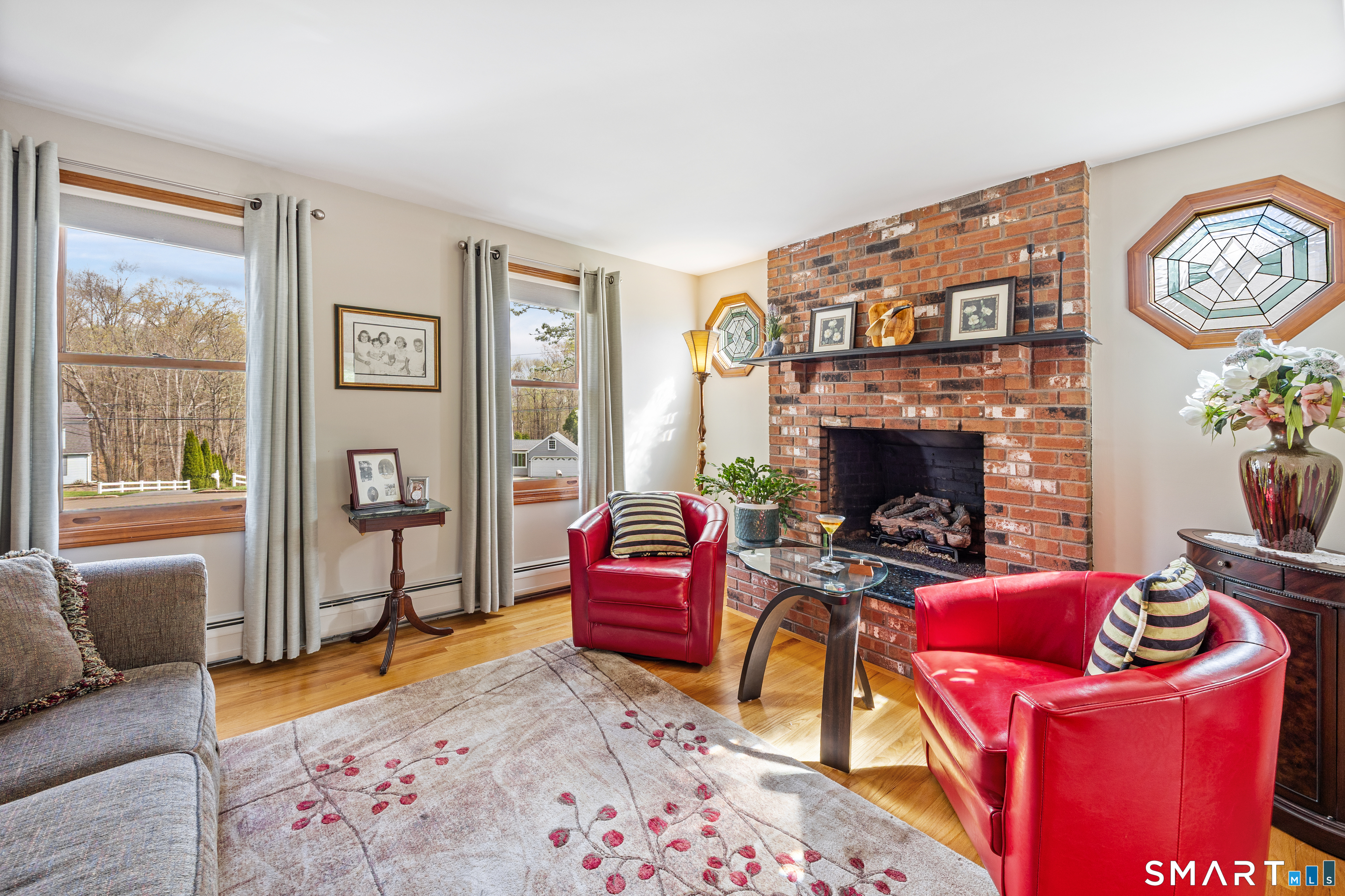 42 Chimney Sweep Road Wallingford, CT 06492 - Photo 19 of 40 a living room with furniture and a fireplace