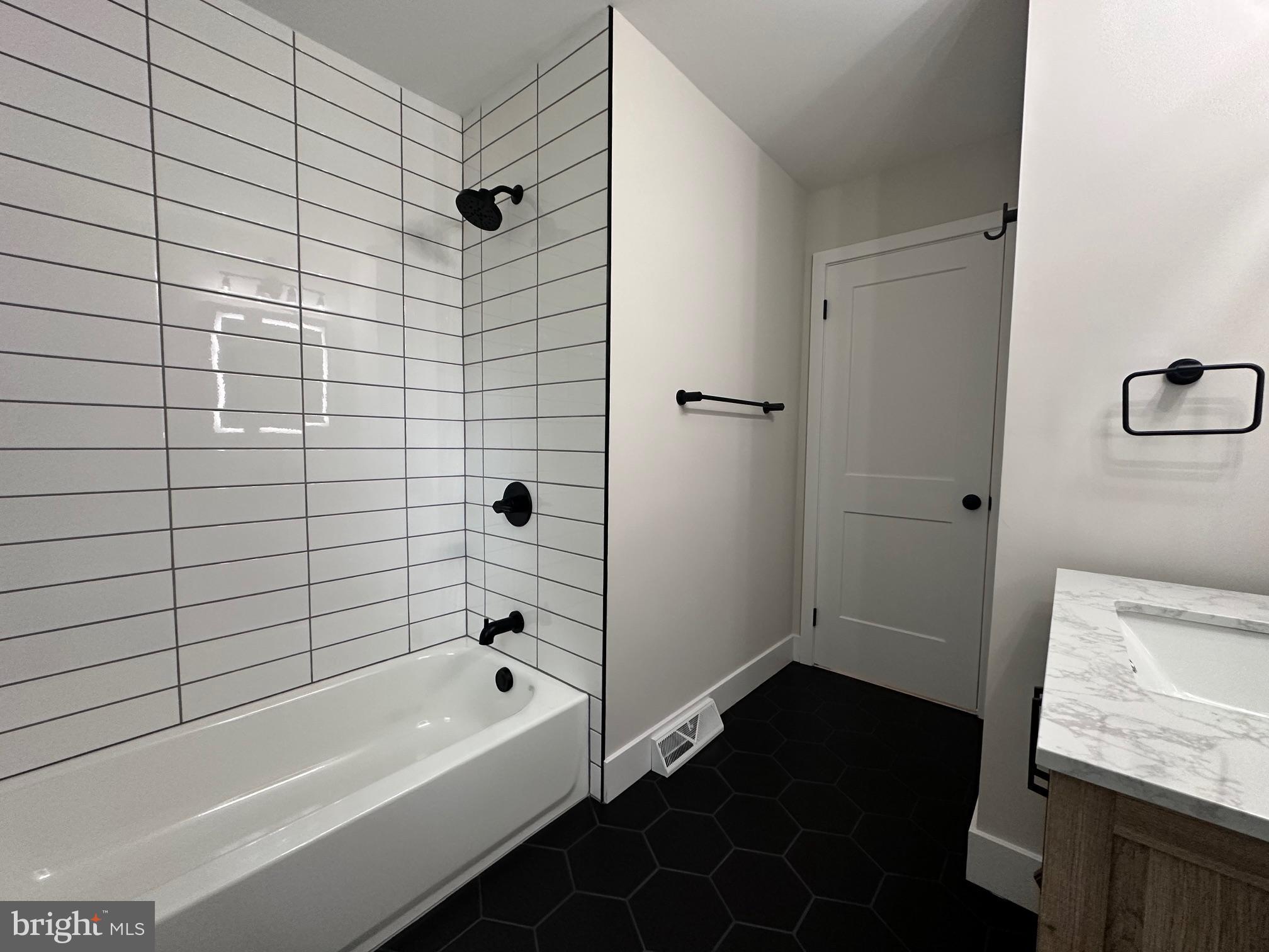 215 Bridge Road Upper Chichester, PA 19061 - Photo 20 of 35 a bathroom with a bathtub and shower