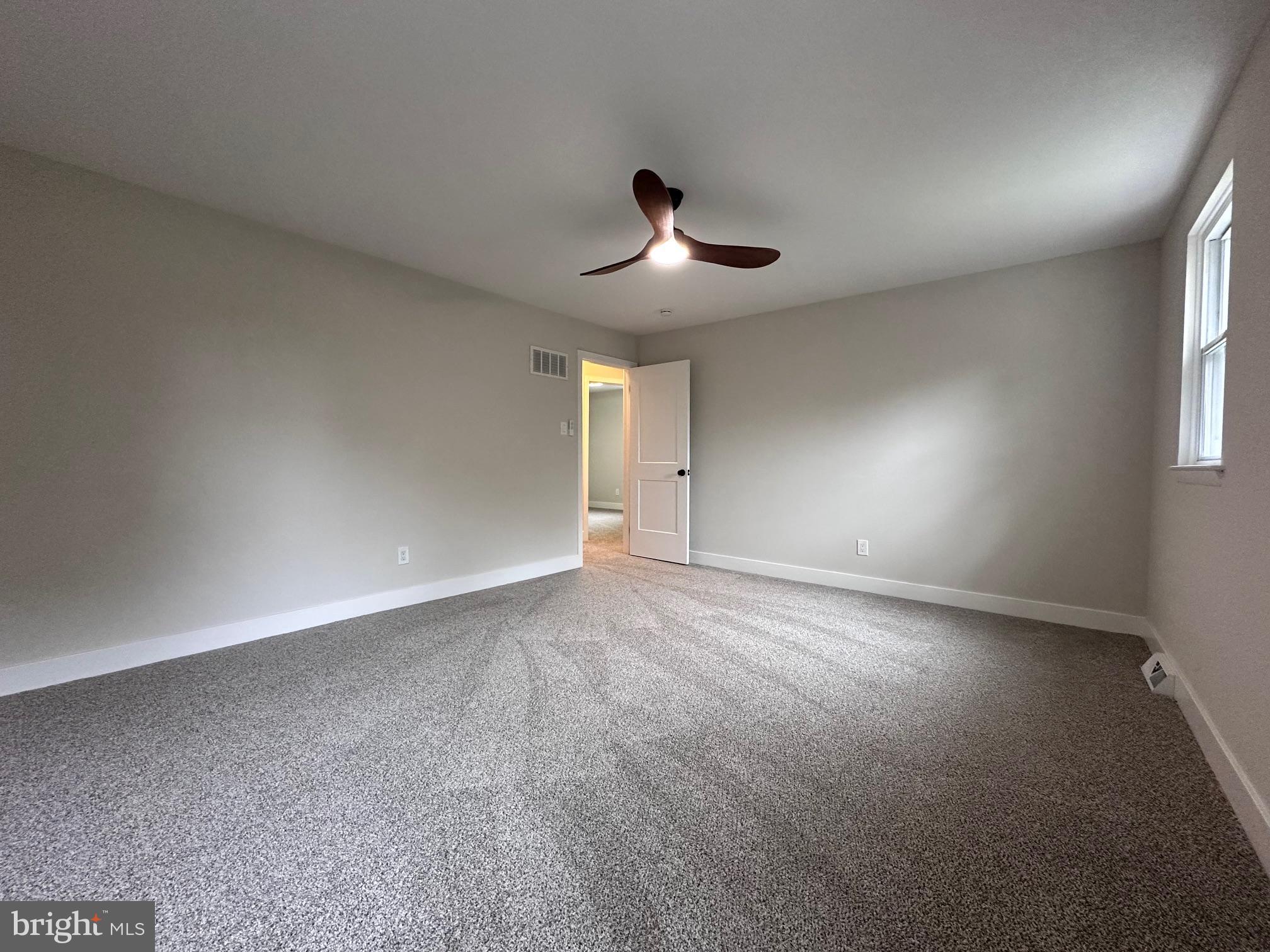 215 Bridge Road Upper Chichester, PA 19061 - Photo 23 of 35 an empty room with a empty space and a window