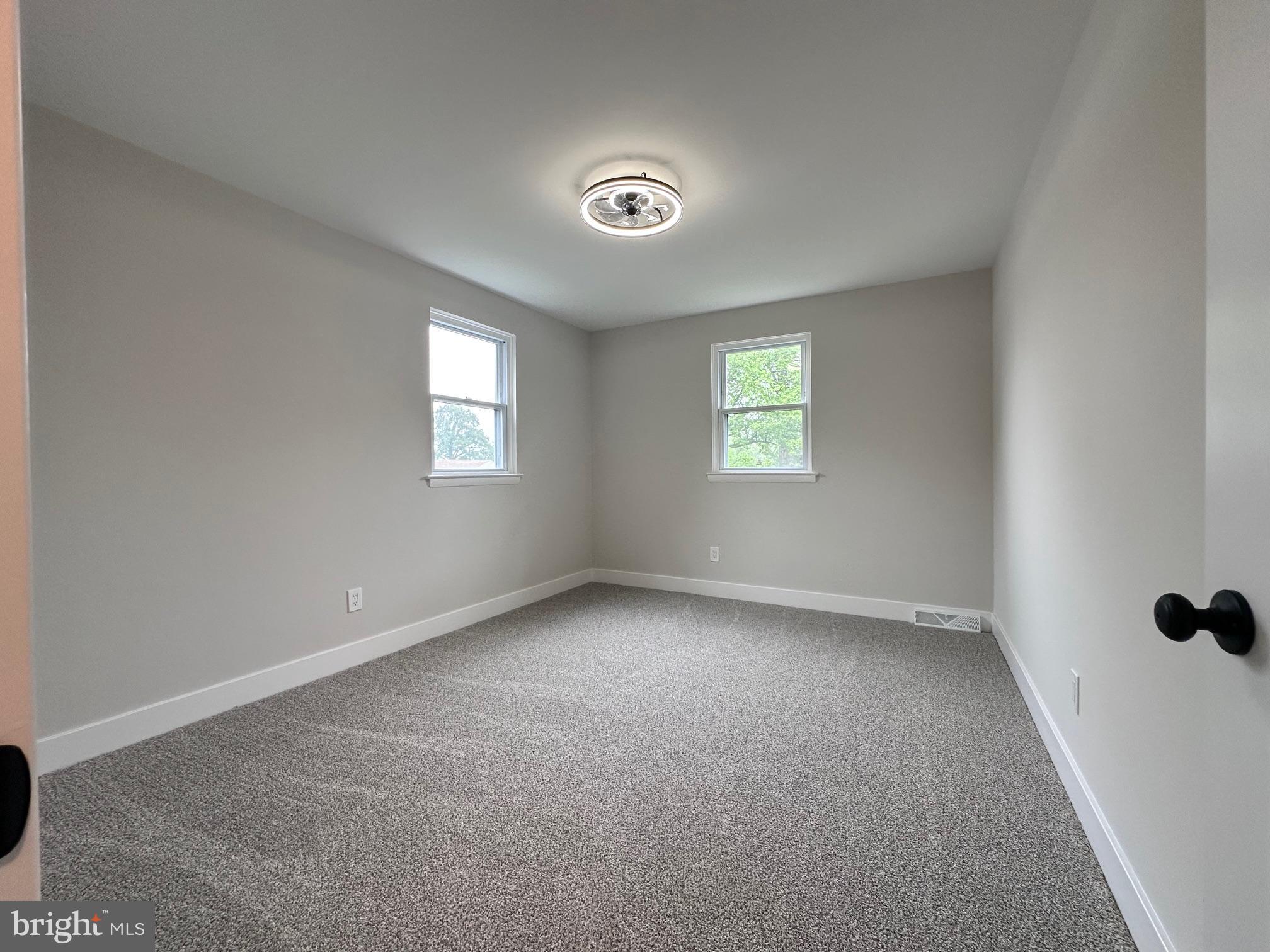 215 Bridge Road Upper Chichester, PA 19061 - Photo 28 of 35 an empty room with windows and closet