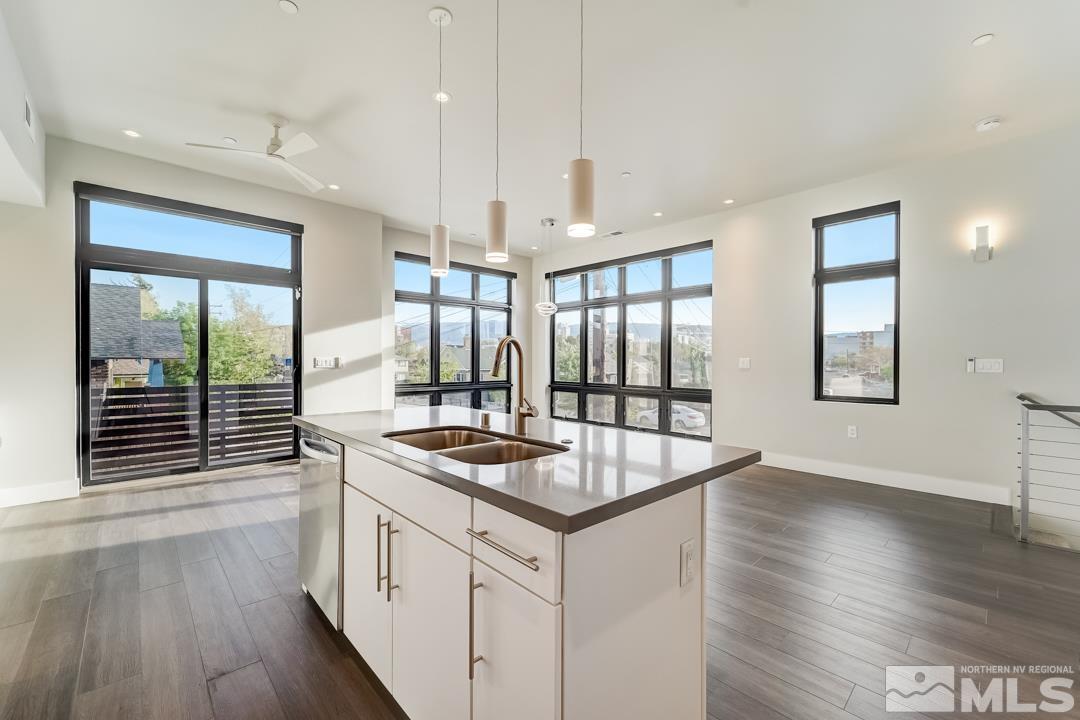 100 High Street, Unit 100 Reno, NV 89502 - Photo 11 of 20 a kitchen that has a sink a stove and wooden floor