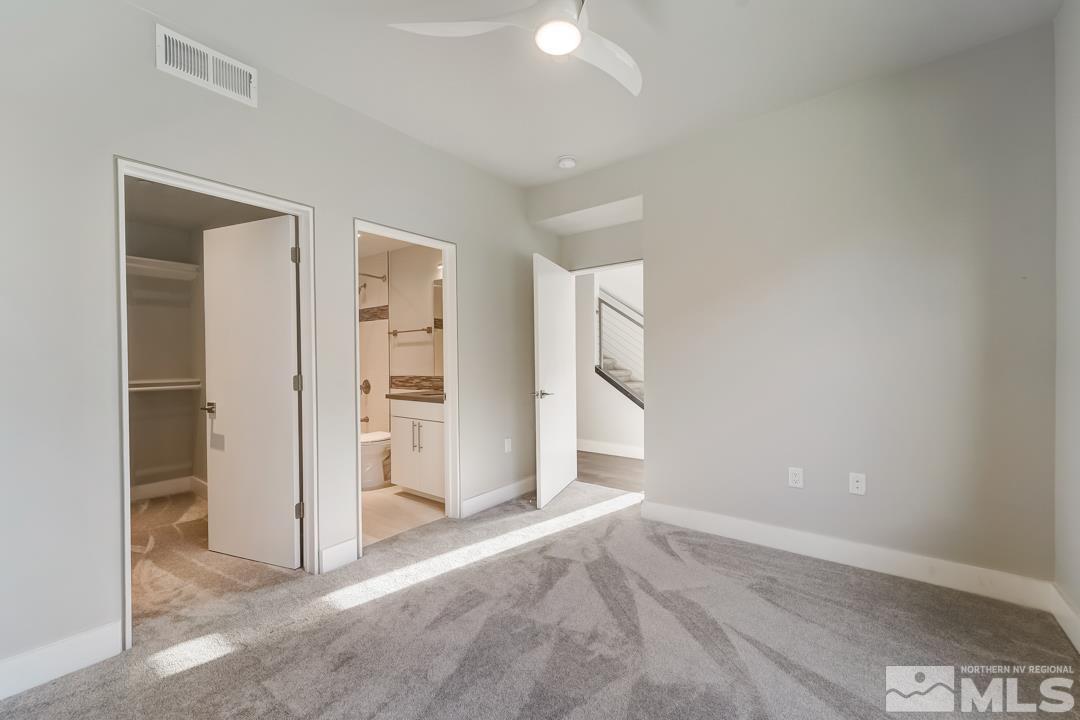 100 High Street, Unit 100 Reno, NV 89502 - Photo 14 of 20 an empty room with closet and windows